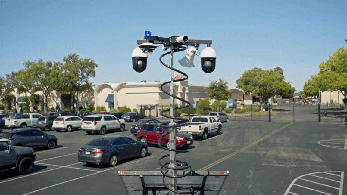 Verkada MT81 security trailer positioned to cover an open commercial lot in daylight